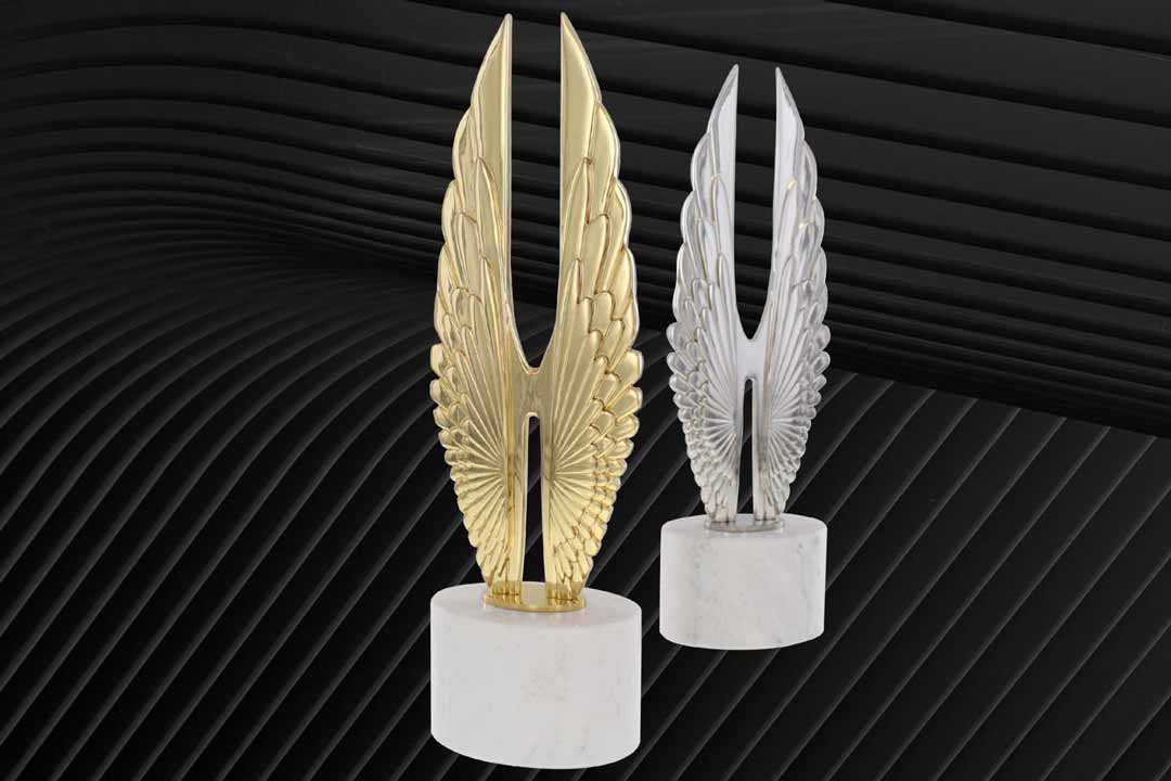 Two Hermes Creative Awards, one gold and one platinum, against a stylized background